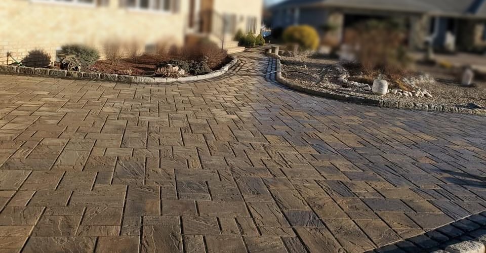 Decorative paving and a curved walkway completed by Dreamers Paving